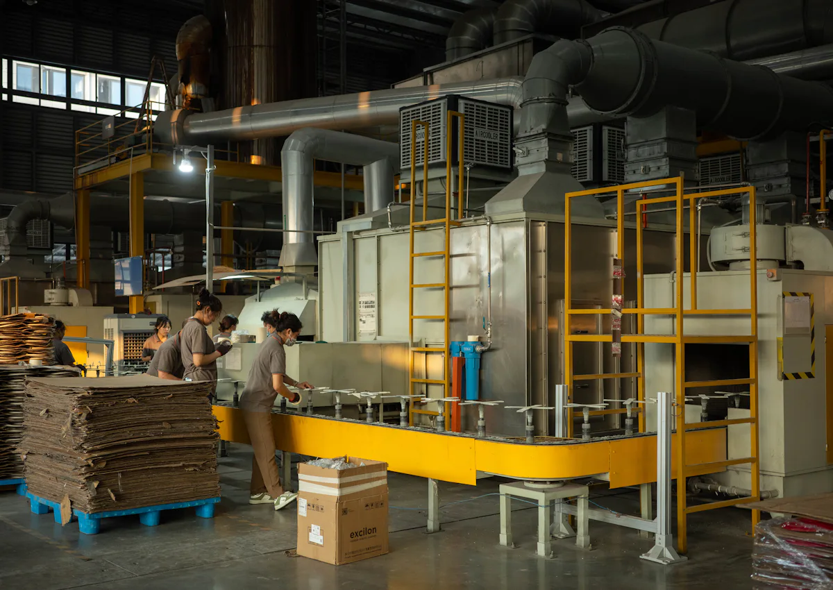 Workers on a paper and board production line