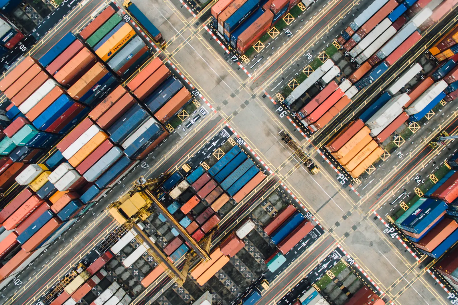 Aerial view of containers arranged at a shipping port